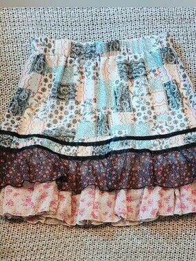 Après Jour patchwork tiered ruffle mini skirt with mixed floral patterns